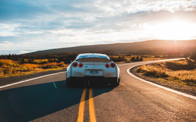 A car drives down a road